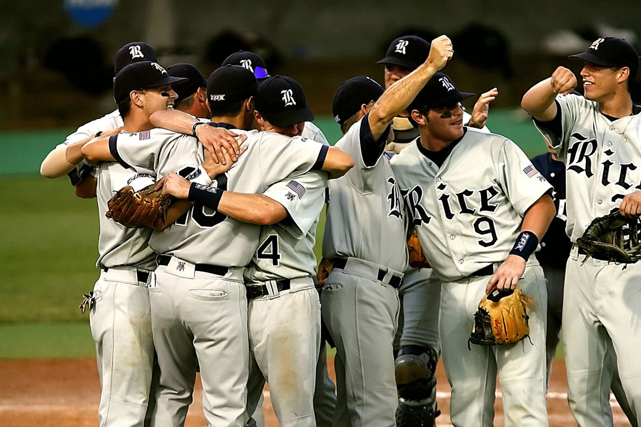 About Baseball team celebrating victory on a field, showcasing teamwork and joy.