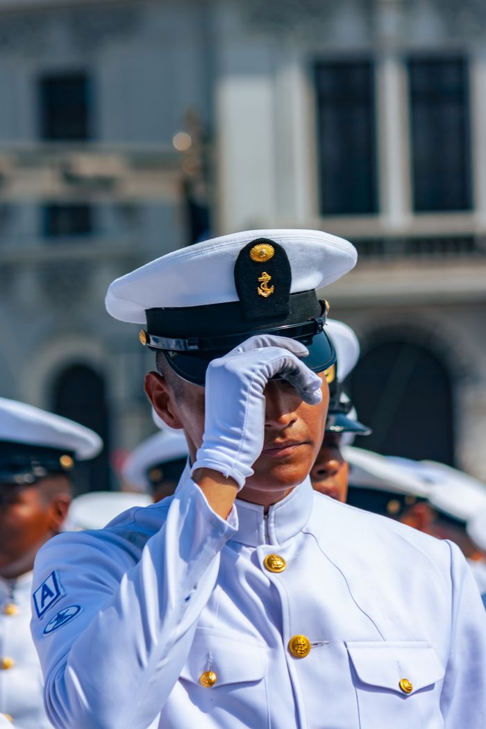 The Art of Drawing Readers In: Your attractive post title goes here Portrait of a Peruvian navy officer saluting in ceremonial uniform in Callao, Peru.
